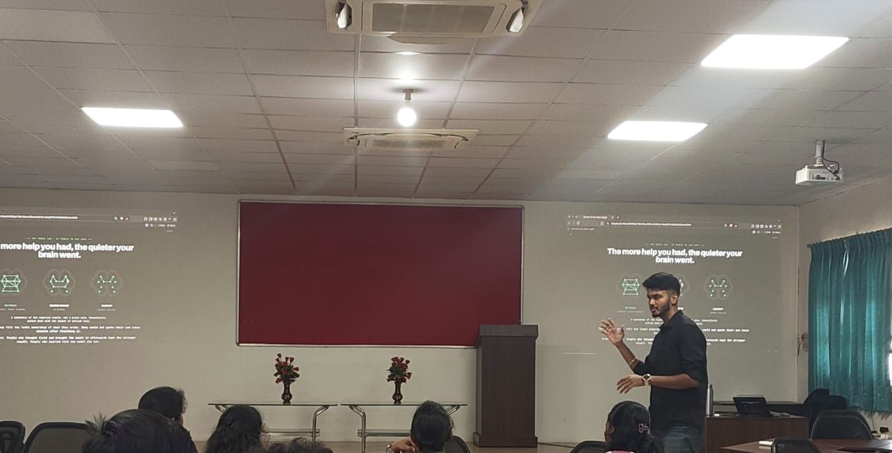 Kanish talking to the class between the two projected slides at Sri Ramakrishna Engineering College