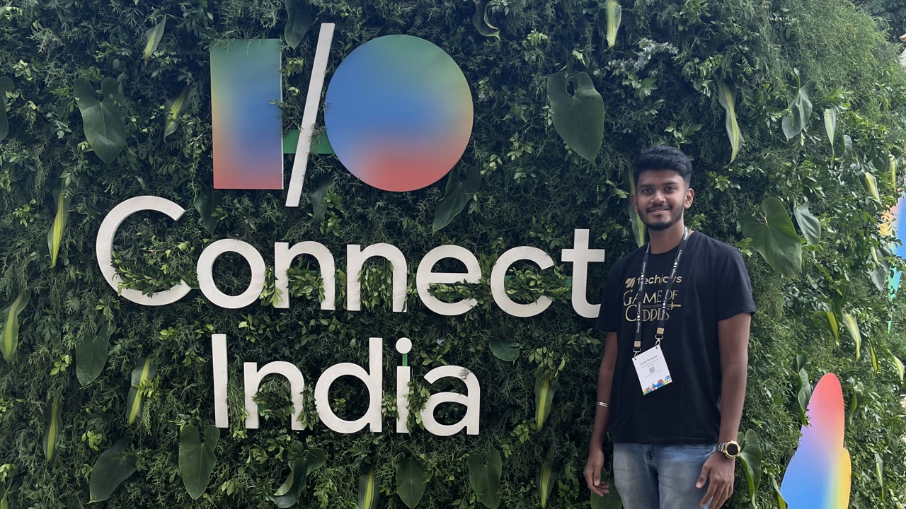 Kanish beside the I/O Connect India sign at the venue in Bangalore