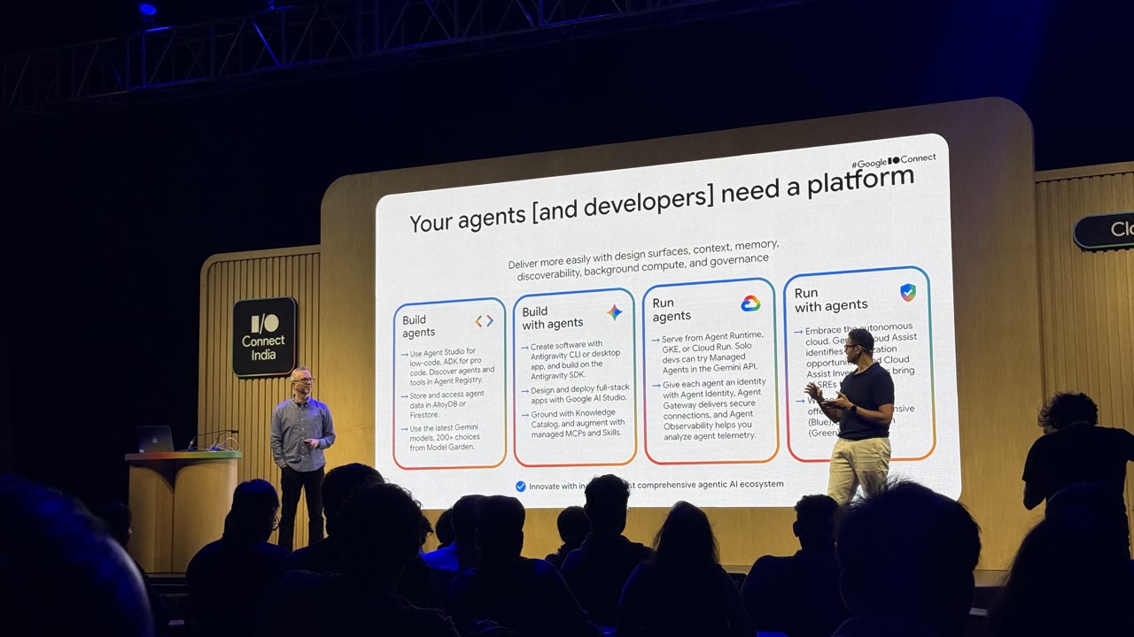 Two speakers on stage beside a slide that reads: Your agents (and developers) need a platform