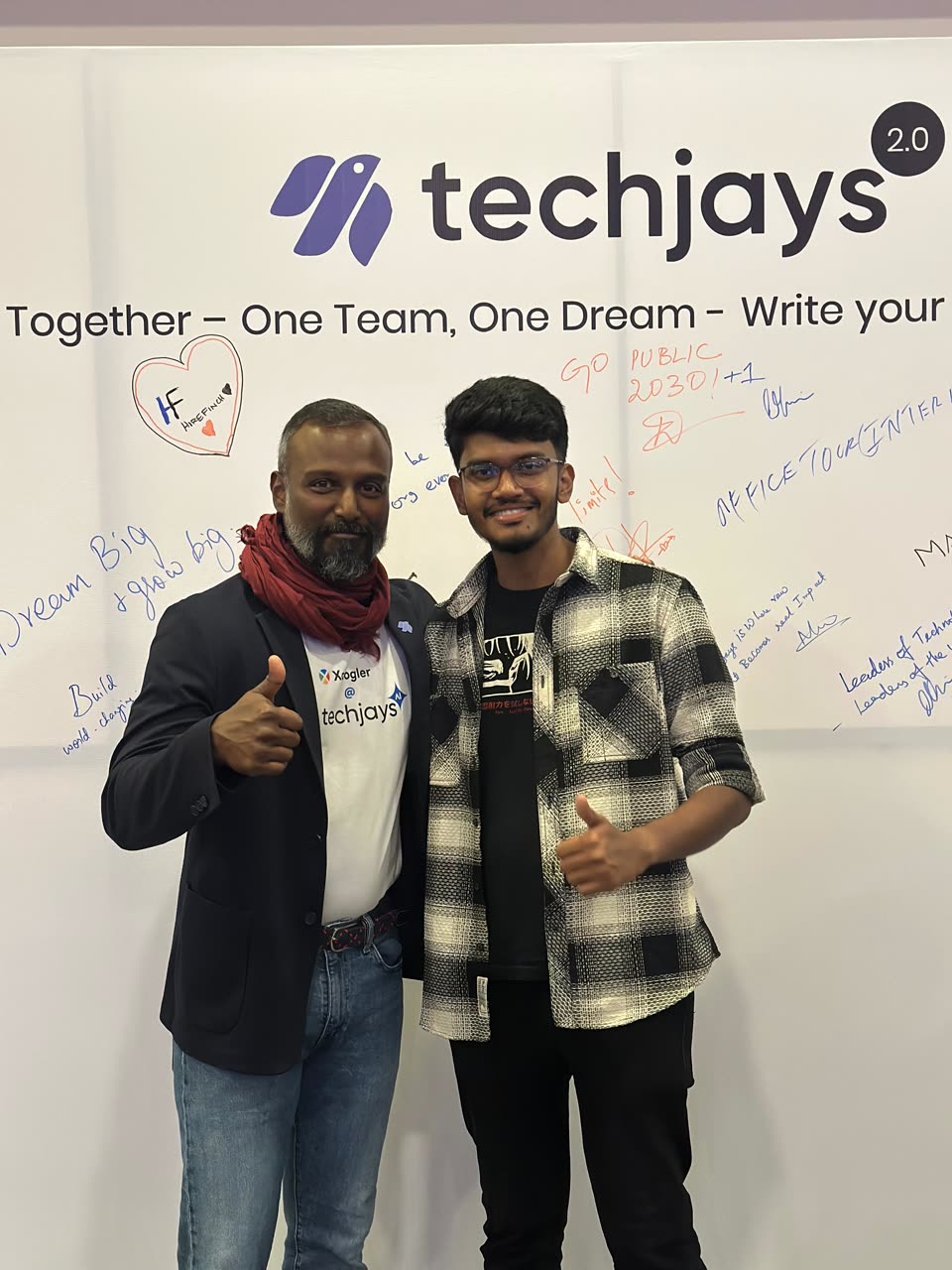 Kanish with Philip, CEO, at the signature wall at the celebration
