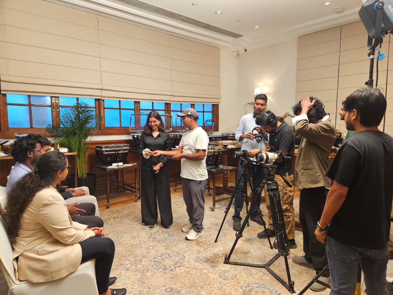 A film crew setting up cameras
