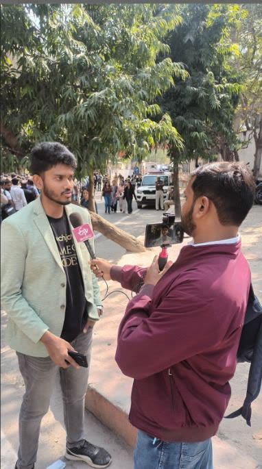Kanish being interviewed by an ETV Bharat reporter outside the venue