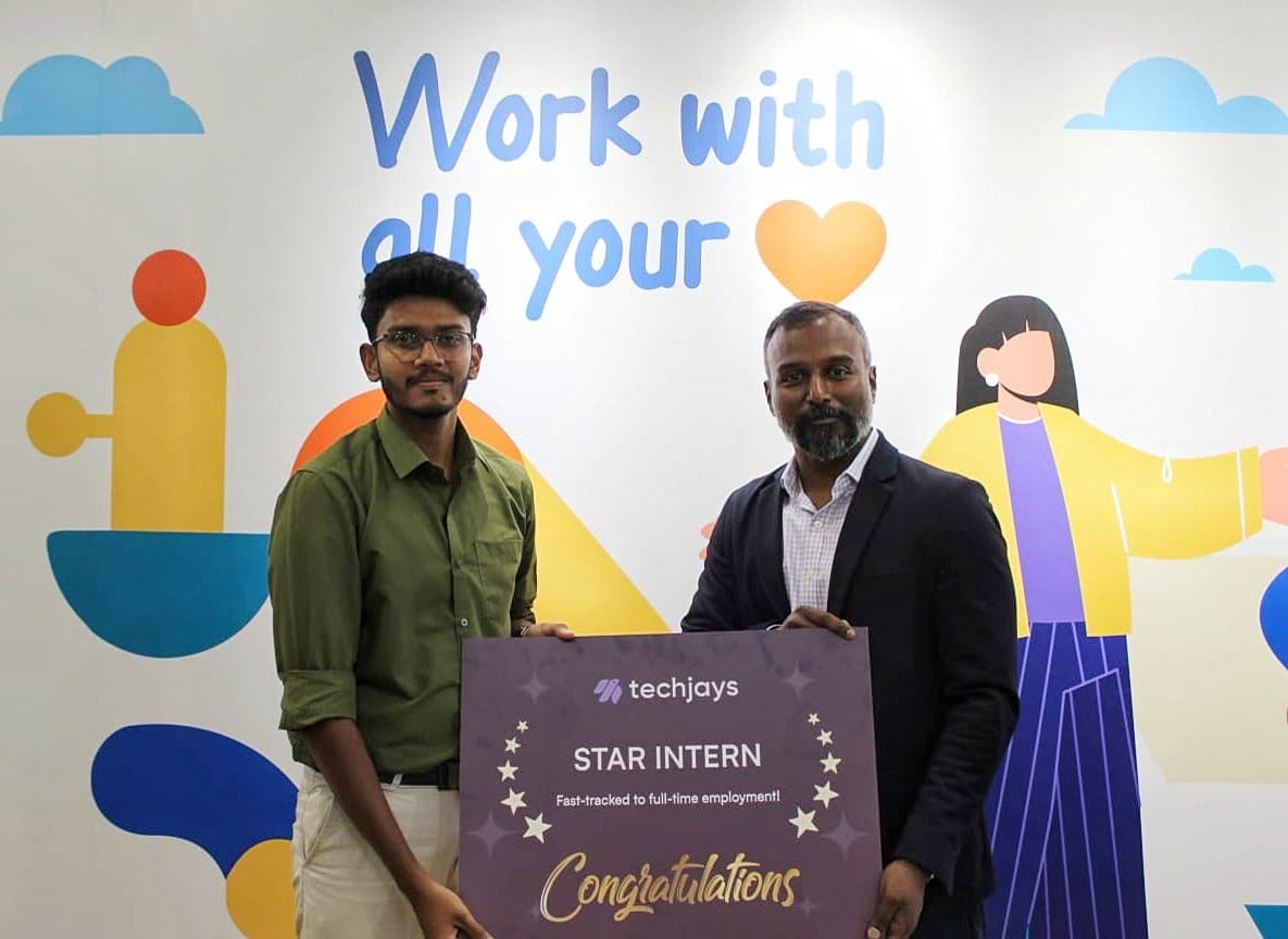 Kanish and Philip, CEO, holding the Star Intern board