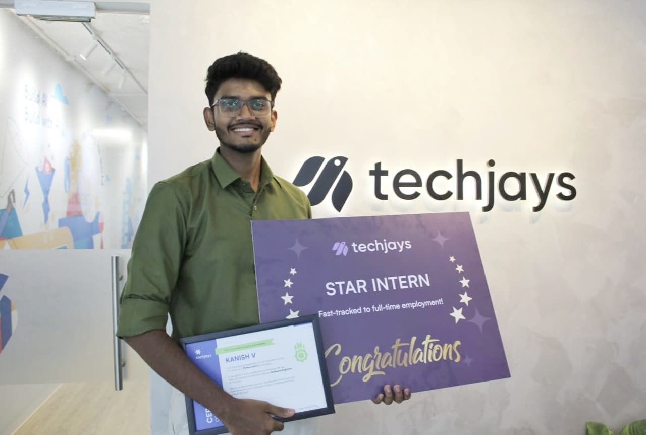 Kanish holding the Star Intern board and his certificate at the Techjays office